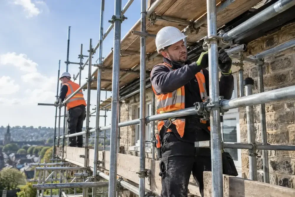 Professional scaffolder installing safe access